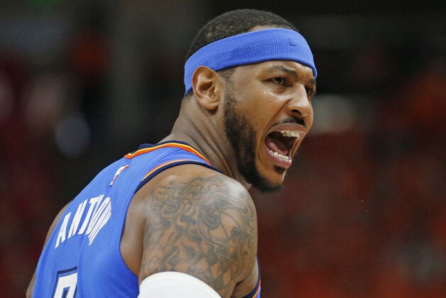 Oklahoma City Thunder forward Carmelo Anthony shouts to his team during the second half of Game 3 in an NBA basketball first-round playoff series against the Utah Jazz on Saturday, April 21, 2018, in Salt Lake City. The Jazz won 115-102. (AP Photo/Rick Bowmer)