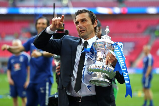 LONDON, ENGLAND - MAY 19:  Antonio Conte, Manager of Chelsea holds the Emirates FA Cup trophy following his side's win during The Emirates FA Cup Final between Chelsea and Manchester United at Wembley Stadium on May 19, 2018 in London, England.  (Photo by Catherine Ivill/Getty Images)