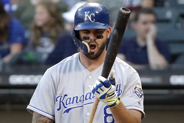 Kansas City Royals' Mike Moustakas checks his bat during the first inning of the team's baseball game against the Chicago White Sox, Friday, July 13, 2018, in Chicago. (AP Photo/Nam Y. Huh)