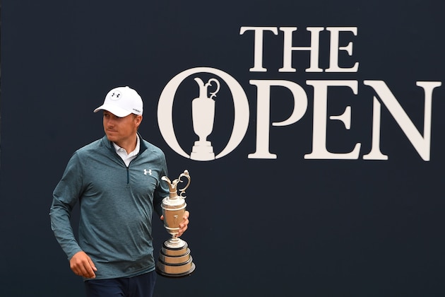 Defending champion, US golfer Jordan Spieth holds the 2017 winner's trophy during a media event at The 147th Open Championship at Carnoustie, Scotland on July 16, 2018. (Photo by ANDY BUCHANAN / AFP)        (Photo credit should read ANDY BUCHANAN/AFP/Getty Images)