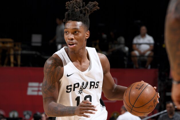 LAS VEAGS, NV - JULY 8: Lonnie Walker IV #18 of the San Antonio Spurs handles the ball against the Washington Wizards during the 2018 Las Vegas Summer League on July 8, 2018 at the Thomas & Mack Center in Las Vegas, Nevada. NOTE TO USER: User expressly acknowledges and agrees that, by downloading and/or using this Photograph, user is consenting to the terms and conditions of the Getty Images License Agreement. Mandatory Copyright Notice: Copyright 2018 NBAE (Photo by Garrett Ellwood/NBAE via Getty Images)