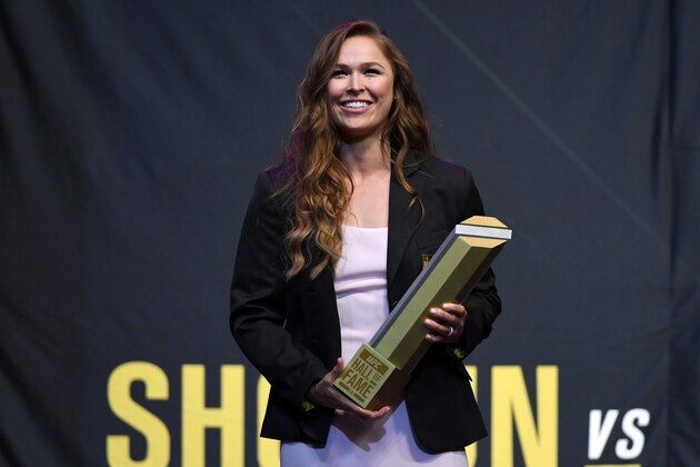 LAS VEGAS, NV - JULY 05:  Ronda Rousey holds a trophy onstage after becoming the first female inducted into the UFC Hall of Fame at The Pearl concert theater at Palms Casino Resort on July 5, 2018 in Las Vegas, Nevada.  (Photo by Ethan Miller/Getty Images)