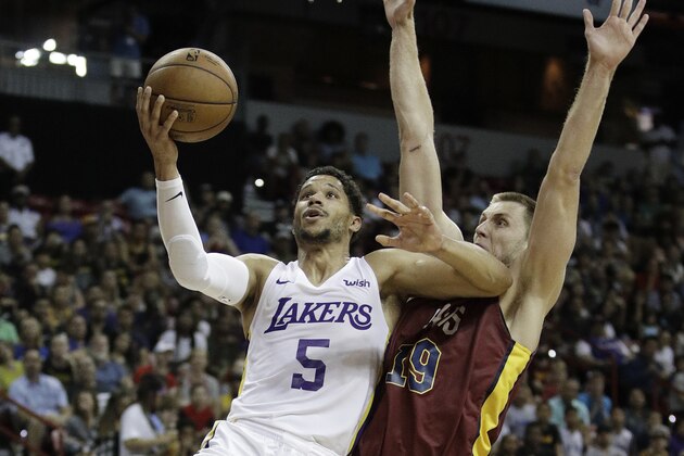 Los Angeles Lakers' Josh Hart shoots around Cleveland Cavaliers' Vladimir Brodziansky during overtime of an NBA summer league basketball game, Monday, July 16, 2018, in Las Vegas. (AP Photo/John Locher)