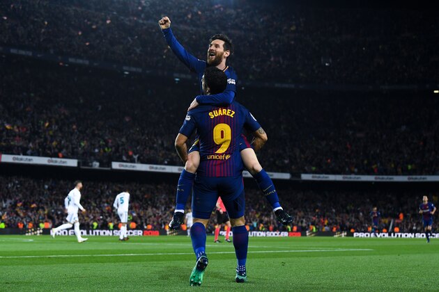 BARCELONA, SPAIN - MAY 06:  Lionel Messi of FC Barcelona celebrates with his team mate Luis Suarez after scoring his team's second goal during the La Liga match between Barcelona and Real Madrid at Camp Nou on May 6, 2018 in Barcelona, Spain.  (Photo by David Ramos/Getty Images)
