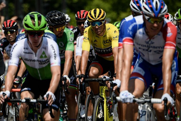 Belgium's Greg Van Avermaet (C-R), wearing the overall leader's yellow jersey, adn Slovakia's Peter Sagan (C-L), wearing the best sprinter's green jersey ride with the pack in Annecy at the start of the tenth stage of the 105th edition of the Tour de France cycling race between Annecy and Le Grand-Bornand, French Alps, on July 17, 2018. (Photo by Philippe LOPEZ / AFP)        (Photo credit should read PHILIPPE LOPEZ/AFP/Getty Images)