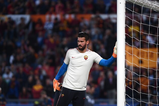 Roma's Brazilian goalkeeper Alisson warms up ahead of the UEFA Champions League semi-final second leg football match between AS Roma and Liverpool at the Olympic Stadium in Rome on May 2, 2018. (Photo by Filippo MONTEFORTE / AFP)        (Photo credit should read FILIPPO MONTEFORTE/AFP/Getty Images)