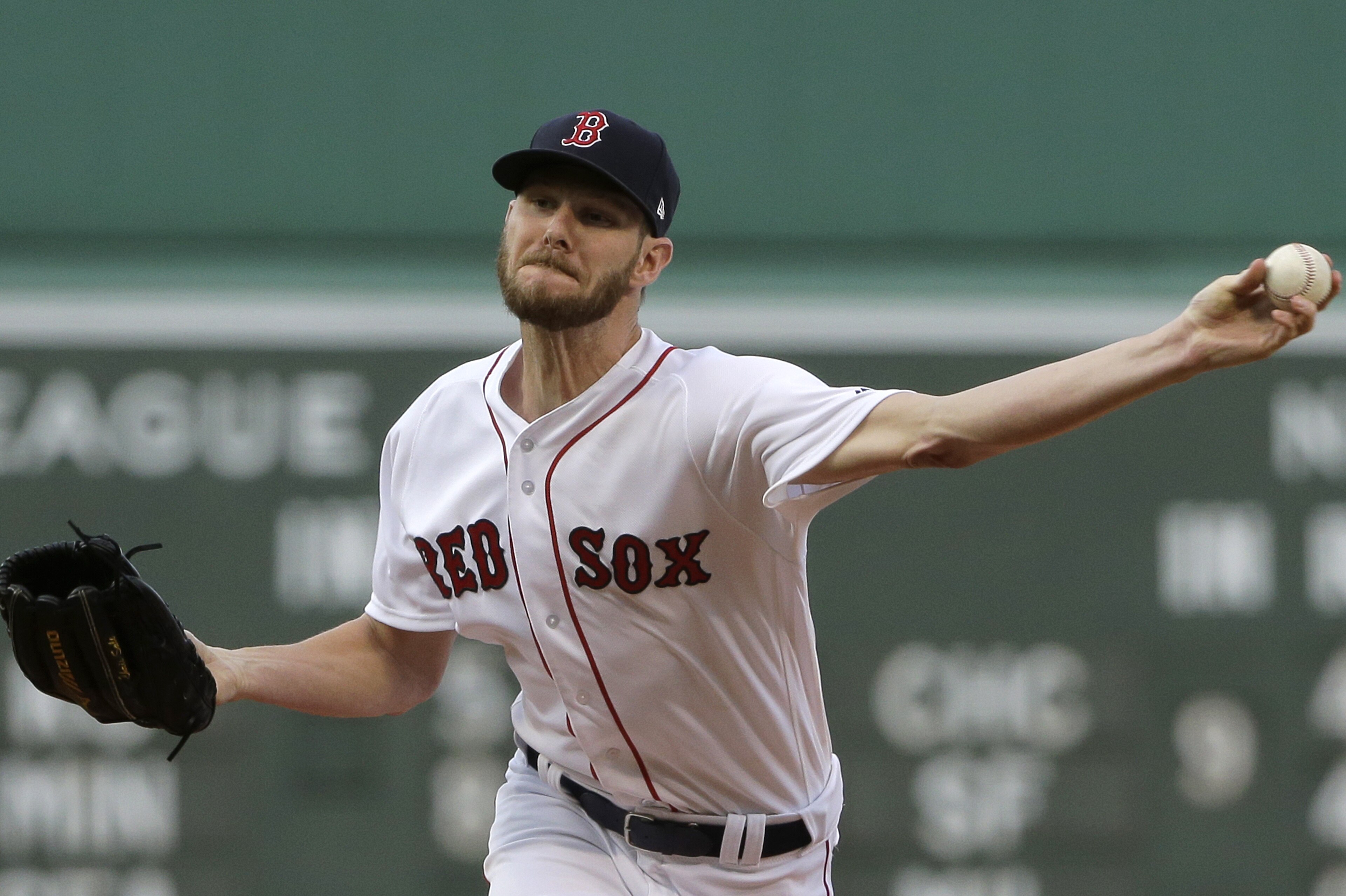 Boston Red Sox's Chris Sale delivers a pitch against the Texas Rangers in the first inning of a baseball game, Wednesday, July 11, 2018, in Boston. (AP Photo/Steven Senne)