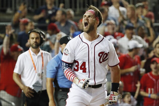 Washington Nationals Bryce Harper celebrates his winning hit during the Major League Baseball Home Run Derby, Monday, July 16, 2018 in Washington. (AP Photo/Alex Brandon)