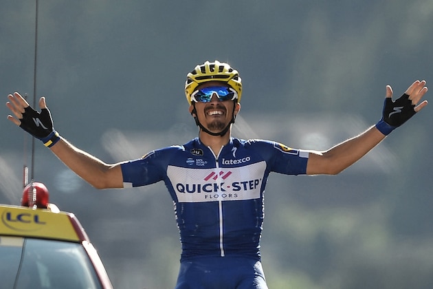 France's Julian Alaphilippe celebrates as he crosses the finish line to win the tenth stage of the 105th edition of the Tour de France cycling race between Annecy and Le Grand-Bornand, French Alps, on July 17, 2018. (Photo by Marco BERTORELLO / AFP) / ALTERNATIVE CROP        (Photo credit should read MARCO BERTORELLO/AFP/Getty Images)