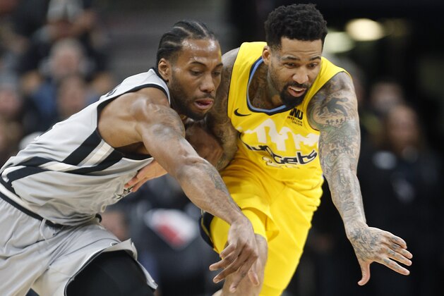 SAN ANTONIO,TX - JANUARY 13 :  Kawhi Leonard #2 of the San Antonio Spurs steals the back from Wilson Chandler #21 of the Denver Nuggets at AT&T Center on January 13, 2018  in San Antonio, Texas.  NOTE TO USER: User expressly acknowledges and agrees that , by downloading and or using this photograph, User is consenting to the terms and conditions of the Getty Images License Agreement. (Photo by Ronald Cortes/Getty Images)