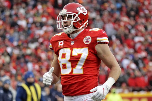 Kansas City Chiefs tight end Travis Kelce (87) runs during the first half of an NFL wild-card playoff football game in front of Tennessee Titans safety Johnathan Cyprien (37) , in Kansas City, Mo., Saturday, Jan. 6, 2018. (AP Photo/Charlie Riedel)