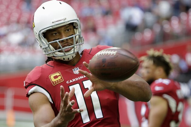 Arizona Cardinals wide receiver Larry Fitzgerald warms up prior to an NFL football game against the Tennessee Titans, Sunday, Dec.10, 2017, in Glendale, Ariz. (AP Photo/Rick Scuteri)