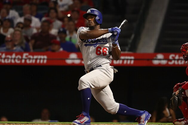 ANAHEIM, CA - JULY 06:  Yasiel Puig #66 of the Los Angeles Dodgers bats during the fifth inning of the MLB game against the Los Angeles Angels of Anaheim at Angel Stadium on July 6, 2018 in Anaheim, California. The Angels defeated the Dodgers 3-2.  (Photo by Victor Decolongon/Getty Images)