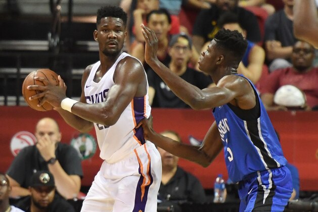 LAS VEGAS, NV - JULY 09:  Deandre Ayton #22 of the Phoenix Suns is guarded by Mohamed Bamba #5 of the Orlando Magic during the 2018 NBA Summer League at the Thomas & Mack Center on July 9, 2018 in Las Vegas, Nevada. The Suns defeated the Magic 71-53. NOTE TO USER: User expressly acknowledges and agrees that, by downloading and or using this photograph, User is consenting to the terms and conditions of the Getty Images License Agreement.  (Photo by Ethan Miller/Getty Images)