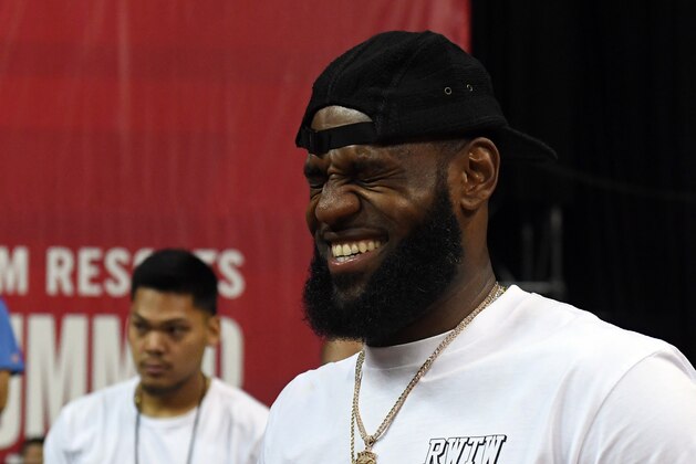 LAS VEGAS, NV - JULY 15:  LeBron James of the Los Angeles Lakers laughs as he attends a quarterfinal game of the 2018 NBA Summer League between the Lakers and the Detroit Pistons at the Thomas & Mack Center on July 15, 2018 in Las Vegas, Nevada. NOTE TO USER: User expressly acknowledges and agrees that, by downloading and or using this photograph, User is consenting to the terms and conditions of the Getty Images License Agreement.  (Photo by Ethan Miller/Getty Images)