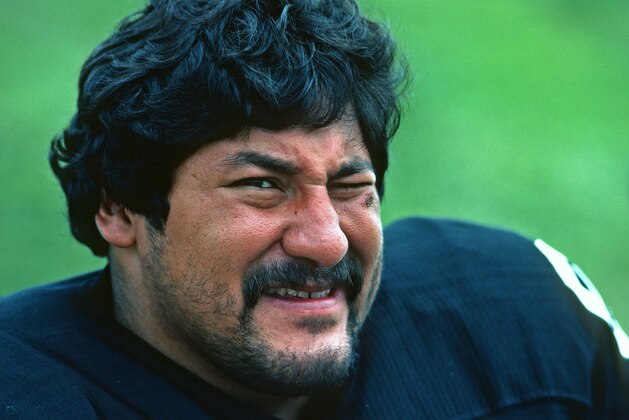LATROBE, PA - JULY 1983:  Defensive lineman Gabe Rivera of the Pittsburgh Steelers looks on from the field during summer training camp at St. Vincent College in July 1983 in Latrobe, Pennsylvania. (Photo by George Gojkovich/Getty Images)