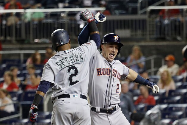WASHINGTON, DC - JULY 17: Alex Bregman #2 of the Houston Astros and the American League celebrates with Jean Segura #2 of the Seattle Mariners and the American League after hitting a solo home run in the tenth inning against the National League during the 89th MLB All-Star Game, presented by Mastercard at Nationals Park on July 17, 2018 in Washington, DC.  (Photo by Rob Carr/Getty Images)
