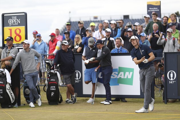 Jordan Spieth, right, of the United States plays a shot from the 18th tee during a practice round for the 147th Open golf Championship at Carnoustie golf club, Scotland, Tuesday, July 17th 2018. (AP Photo/Peter Morrison)