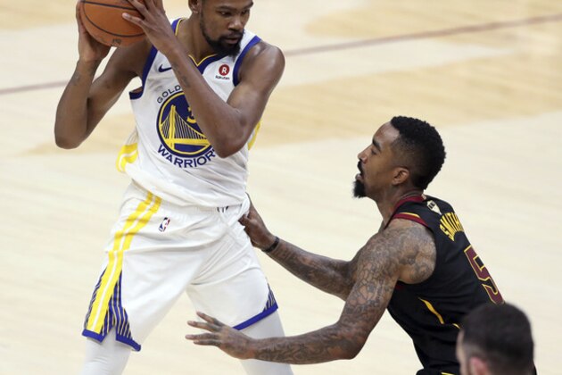 Golden State Warriors' Kevin Durant is defended by Cleveland Cavaliers' JR Smith during the second half of Game 4 of basketball's NBA Finals, Friday, June 8, 2018, in Cleveland. (AP Photo/Carlos Osorio)