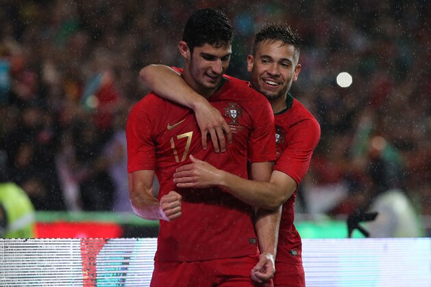 LISBON, PORTUGAL - JUNE 7:  Portugal and Valencia FC forward Goncalo Guedes celebrates with teammate Portugal and Borussia Dortmund defender Raphael Guerreiro after scoring a goal during the International Friendly match between Portugal and Algeria at Estadio da Luz on June 7, 2018 in Lisbon, Portugal.  (Photo by Gualter Fatia/Getty Images)