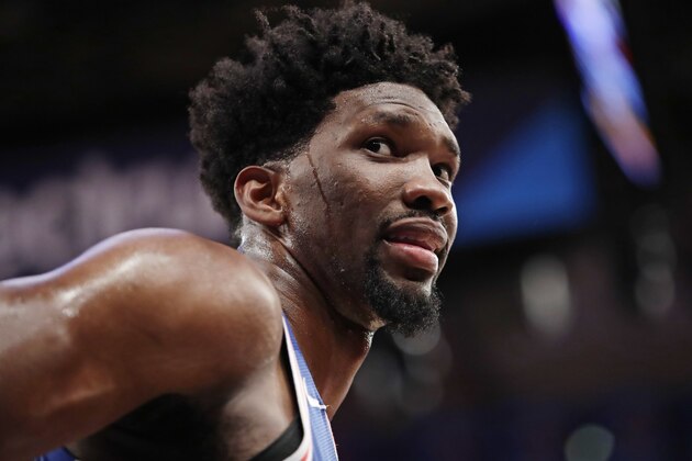 FILE - In this March 15, 2018, file photo, Philadelphia 76ers' Joel Embiid (21) talks to spectators during the second half of the team's NBA basketball game against the New York Knicks in New York. 76ers general manager Bryan Colangelo is denying a report connecting the executive to Twitter accounts that criticized Sixers players Embiid and Markelle Fultz, among other NBA figures. The accounts also took aim at former Sixers GM Sam Hinkie, Toronto Raptors executive Masai Ujiri and former Sixers players Jahlil Okafor and Nerlens Noel, according to a report by The Ringer (AP Photo/Frank Franklin II, File)