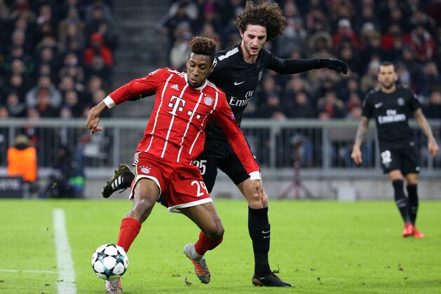 MUNICH, GERMANY - DECEMBER 5: Kingsley Coman of Bayern Munich, Adrien Rabiot of PSG during the UEFA Champions League group B match between Bayern Muenchen (Bayern Munich) and Paris Saint-Germain (PSG) at Allianz Arena on December 5, 2017 in Munich, Germany. (Photo by Jean Catuffe/Getty Images)