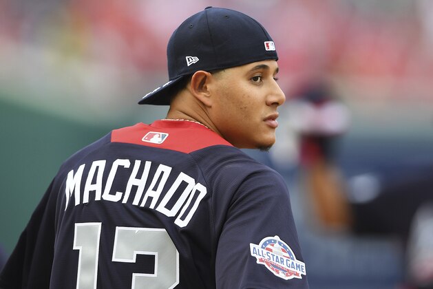 American League, Baltimore Orioles shortstop Manny Machado looks over his shoulder as he walks onto the field before the Major League Baseball All-star Game, Tuesday, July 17, 2018 in Washington. (AP Photo/Nick Wass)