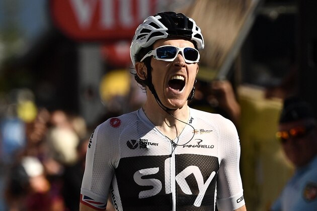 TOPSHOT - Great Britain's Geraint Thomas celebrates as he crosses the finish line to win the eleventh stage of the 105th edition of the Tour de France cycling race between Albertville and La Rosiere, French Alps, on July 18, 2018. (Photo by Marco BERTORELLO / AFP)        (Photo credit should read MARCO BERTORELLO/AFP/Getty Images)