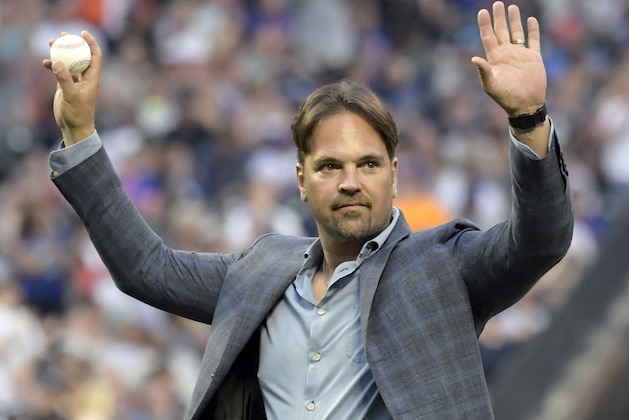 Former New York Mets catcher Mike Piazza acknowledges the fans before throwing out the ceremonial first pitch before a Mets baseball game against the New York Yankees, Saturday, June 9, 2018, in New York. (AP Photo/Bill Kostroun)