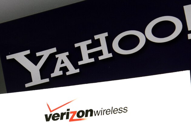 FILE - This Monday, July 25, 2016, file photo shows Yahoo and Verizon logos on a laptop, in North Andover, Mass. Verizon is pushing further into sports streaming with a new NBA deal that will let Yahoo users watch some out-of-market games. (AP Photo/Elise Amendola, File)