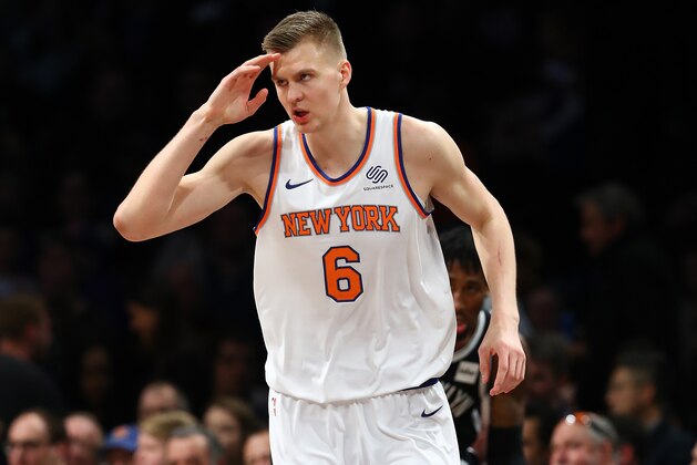 NEW YORK, NY - JANUARY 15:  Kristaps Porzingis #6 of the New York Knicks celebrates after a basket against the Brooklyn Nets during their game at the Barclays Center on January 15, 2018 in New York City.  . User expressly acknowledges and agrees that, by downloading and/or using this Photograph, user is consenting to the terms and conditions of the Getty Images License Agreement.  (Photo by Al Bello/Getty Images)