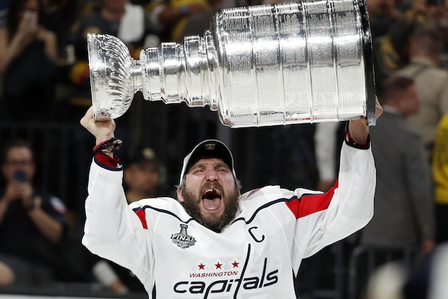 FILE - In this June 7, 2018, file photo, Washington Capitals left wing Alex Ovechkin, of Russia, hoists the Stanley Cup after the Capitals defeated the Golden Knights in Game 5 of the NHL hockey Stanley Cup Finals, in Las Vegas. The past 10 years, Ovechkin went into the offseason facing questions about not being able to win and criticism of not being able to get it done. He is now a playoff MVP and Stanley Cup winner and his epic Stanley Cup celebration will stretch well into the summer. (AP Photo/John Locher, File)