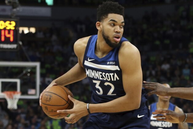 Minnesota Timberwolves' Karl-Anthony Towns plays against the Houston Rockets during the first half of Game 4 in an NBA basketball first-round playoff series Monday, April 23, 2018, in Minneapolis. (AP Photo/Jim Mone)