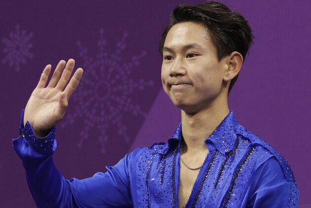 Denis Ten of Kazakhstan reacts as his score is posted following his performance in the men's short program figure skating in the Gangneung Ice Arena at the 2018 Winter Olympics in Gangneung, South Korea, Friday, Feb. 16, 2018. (AP Photo/David J. Phillip)