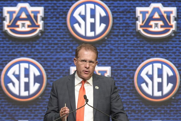 NCAA college football head coach Gus Malzahn of Auburn speaks during the Southeastern Conference Media Days at the College Football Hall of Fame in Atlanta, Thursday, July 19, 2018. (AP Photo/John Amis)