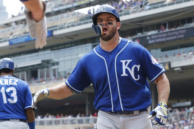 Kansas City Royals' Mike Moustakas is congratulated after his solo home run off Minnesota Twins pitcher Lance Lynn in the third inning of a baseball game Wednesday, July 11, 2018, in Minneapolis. (AP Photo/Jim Mone)