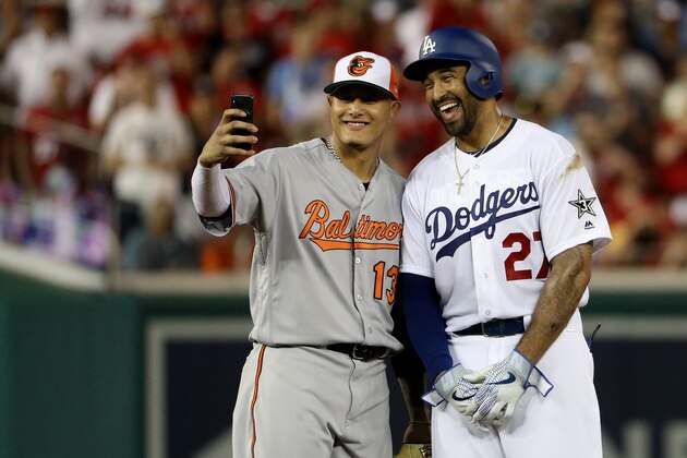 WASHINGTON, DC - JULY 17:  Manny Machado #13 of the Baltimore Orioles and the American League and Matt Kemp #27 of the Los Angeles Dodgers and the National League pose for a selfie in the second inning during the 89th MLB All-Star Game, presented by Mastercard at Nationals Park on July 17, 2018 in Washington, DC.  (Photo by Patrick Smith/Getty Images)