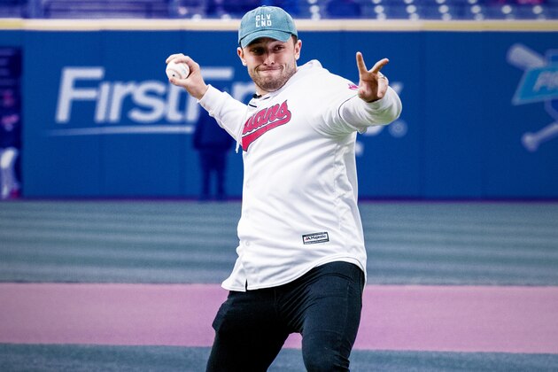 Cleveland Browns draft pick Baker Mayfield throws out the ceremonial first pitch before a baseball game between the Seattle Mariners and the Cleveland Indians, Friday, April 27, 2018, in Cleveland. (AP Photo/Tony Dejak)