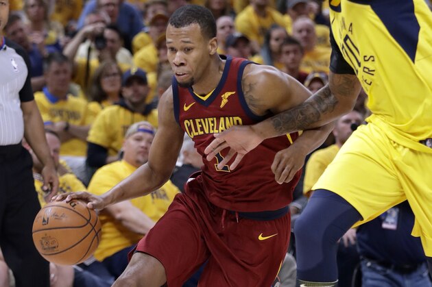 Cleveland Cavaliers' Rodney Hood, left, heads to the basket past Indiana Pacers' Trevor Booker during the first half of Game 6 of a first-round NBA basketball playoff series, Friday, April 27, 2018, in Indianapolis. (AP Photo/Darron Cummings)