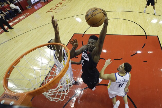 Houston Rockets center Clint Capela, center, drives to the basket over Golden State Warriors forward Kevin Durant, left, and guard Klay Thompson (11) in the first half during Game 7 of the NBA Western Conference Finals, Monday, May 28, 2018, in Houston. (AP Photo/David J. Phillip)