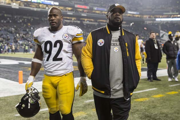 SEATTLE, WA - NOVEMBER 29: Linebacker James Harrison #92 of the Pittsburgh Steelers and head coach Mike Tomlin walk off the field after a football game against the Seattle Seahawks at CenturyLink Field on November 29, 2015 in Seattle, Washington. The Seahawks won the game 39-30. (Photo by Stephen Brashear/Getty Images)