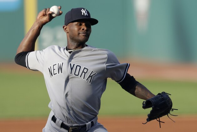 New York Yankees starting pitcher Domingo German delivers during the first inning of the team's baseball game against the Cleveland Indians, Friday, July 13, 2018, in Cleveland. (AP Photo/Tony Dejak)