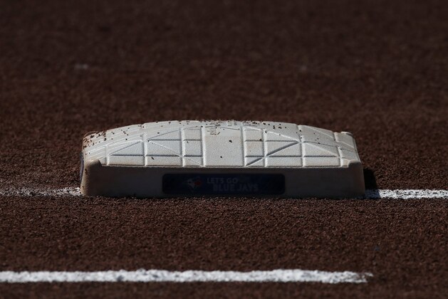 TORONTO, ON - JUNE 15: A detailed backlit view of the first base bag during batting practice before the start of the Toronto Blue Jays MLB game against the Washington Nationals at Rogers Centre on June 15, 2018 in Toronto, Canada. (Photo by Tom Szczerbowski/Getty Images) *** Local Caption ***