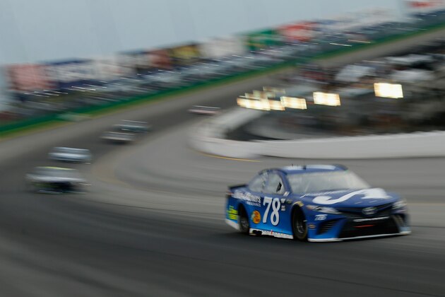 SPARTA, KY - JULY 14: Martin Truex Jr., driver of the #78 Auto-Owners Insurance Toyota, leads a pack of cars during the Monster Energy NASCAR Cup Series Quaker State 400 presented by Walmart at Kentucky Speedway on July 14, 2018 in Sparta, Kentucky.  (Photo by Michael Reaves/Getty Images)
