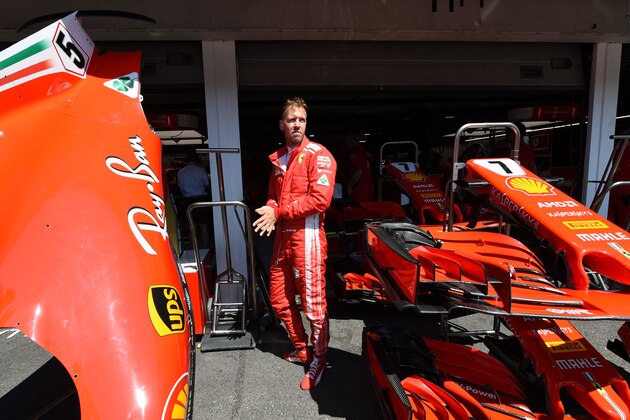 Ferrari's German driver Sebastian Vettel stands in front of the Ferrari garage prior the second free practice session ahead of the German Formula One Grand Prix at the Hockenheimring racing circuit on July 20, 2018 in Hockenheim, southern Germany. (Photo by Christof STACHE / AFP)        (Photo credit should read CHRISTOF STACHE/AFP/Getty Images)