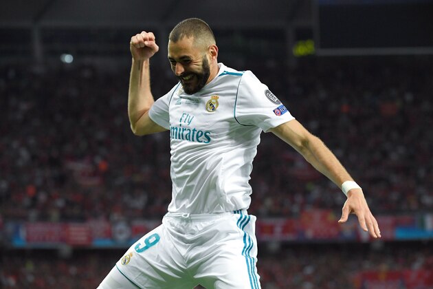 Real Madrid's French forward Karim Benzema celebrates after scoring a goal during the UEFA Champions League final football match between Liverpool and Real Madrid at the Olympic Stadium in Kiev, Ukraine on May 26, 2018. (Photo by LLUIS GENE / AFP)        (Photo credit should read LLUIS GENE/AFP/Getty Images)