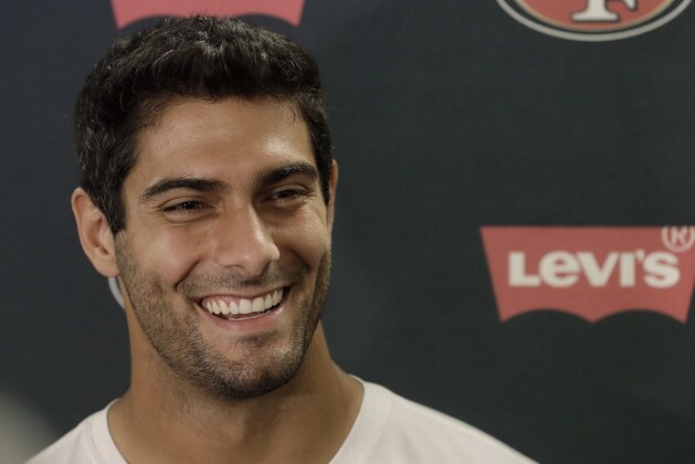 San Francisco 49ers quarterback Jimmy Garoppolo speaks to reporters before NFL football practice at the team's headquarters in Santa Clara, Calif., Wednesday, June 13, 2018. Year one under coach Kyle Shanahan was a bit of a whirlwind for the San Francisco 49ers with new systems to install and a midseason quarterback change to Jimmy Garoppolo. It's far different this year as the Niners wrap up the offseason program. (AP Photo/Jeff Chiu)
