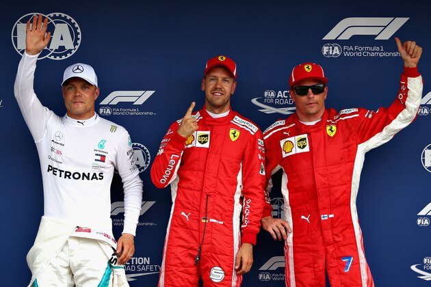 HOCKENHEIM, GERMANY - JULY 21:  Top three qualifiers Sebastian Vettel of Germany and Ferrari, Kimi Raikkonen of Finland and Ferrari and Valtteri Bottas of Finland and Mercedes GP celebrate in parc ferme during qualifying for the Formula One Grand Prix of Germany at Hockenheimring on July 21, 2018 in Hockenheim, Germany.  (Photo by Will Taylor-Medhurst/Getty Images)