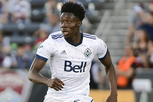 COMMERCE CITY, CO - JUNE 01: Alphonso Davies #67 of Vancouver Whitecaps dribbles upfield against the Colorado Rapids at Dick's Sporting Goods Park on June 1, 2018 in Commerce City, Colorado. (Photo by Timothy Nwachukwu/Getty Images)