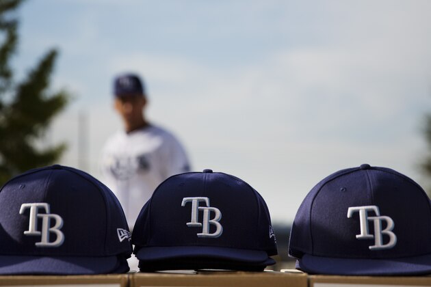 Tampa Bay Rays hats sit on a table waiting for players to get fitted during the team's photo day at baseball spring training in Port Charlotte, Fla., Saturday, Feb. 18, 2017. (AP Photo/David Goldman)